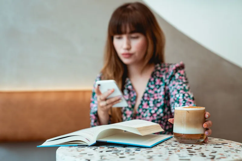 Customer writing a business review on a smartphone