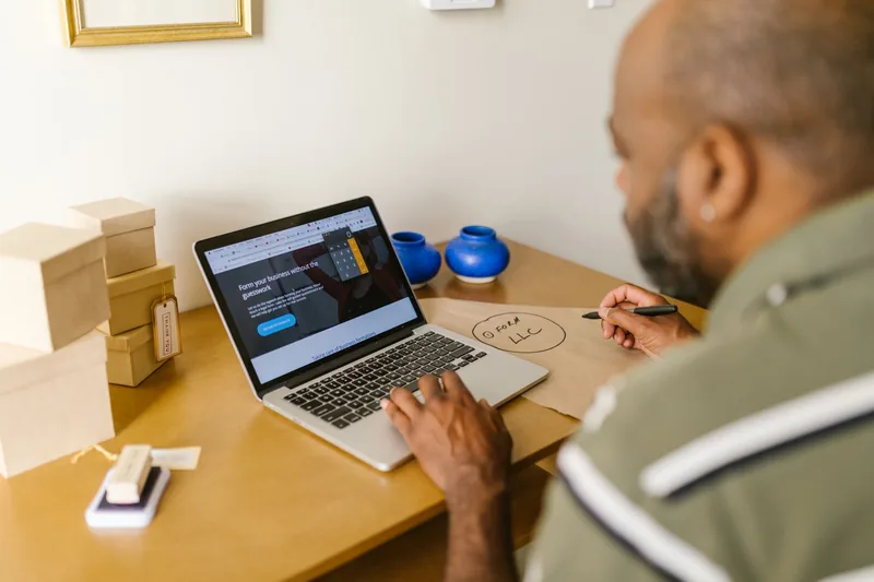 Small-business owner reviewing their website traffic on a laptop