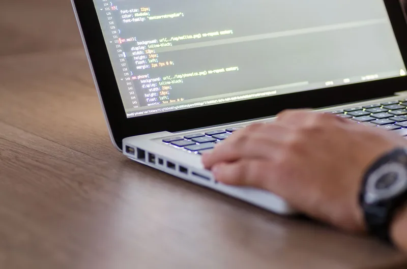 Developer reviewing site performance on a laptop