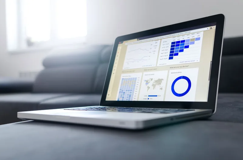 Laptop showing a web analytics dashboard with traffic charts